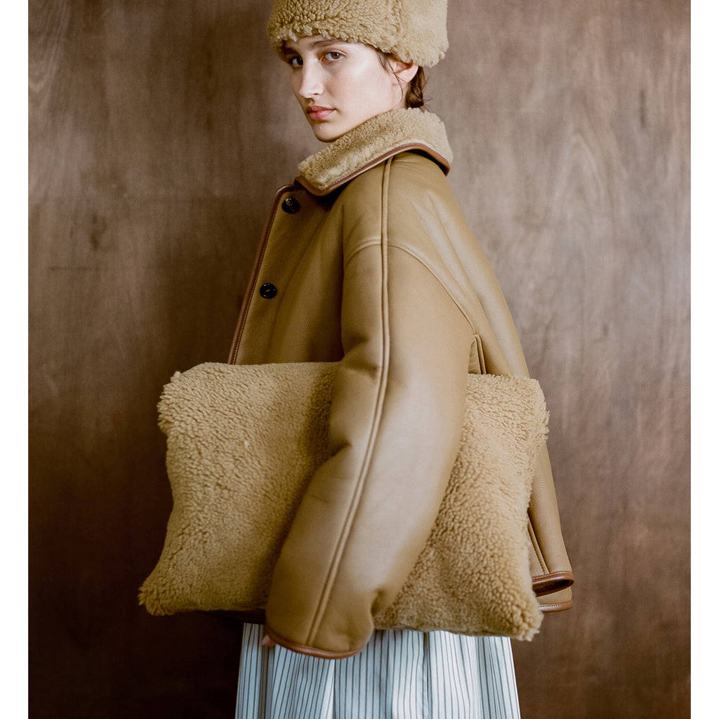shearling clutch bag in tan