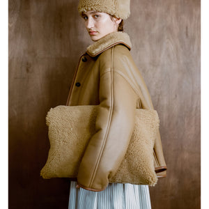 shearling clutch bag in tan