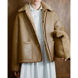shearling clutch bag in tan