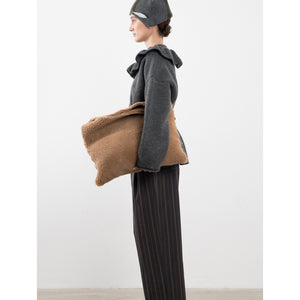 shearling clutch bag in tan