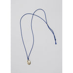 drift pendant on blue silk
