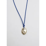 drift pendant on blue silk