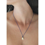 drift pendant on blue silk
