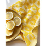 sunrise linen tea towel in lemon