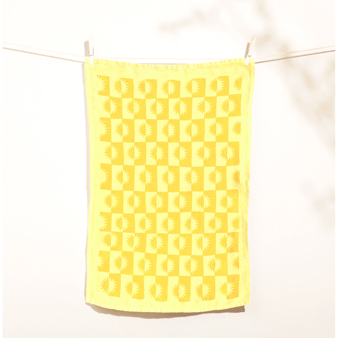 sunrise linen tea towel in lemon