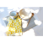 sunrise linen tea towel in lemon