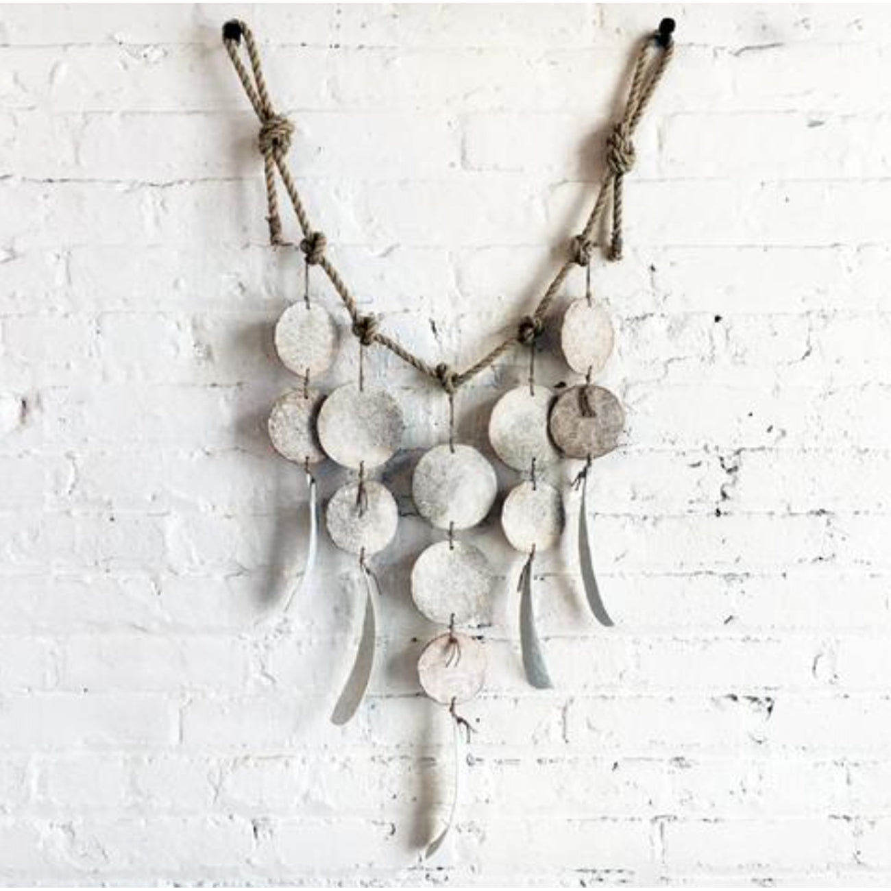 white discs + featherbones wall hanging