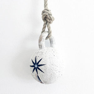 medium jingle bell: white w/ star