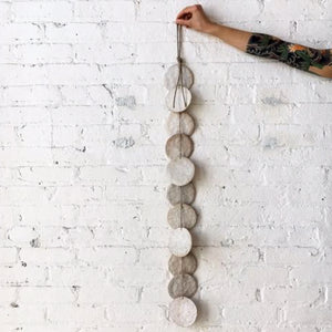 white disc wall hanging