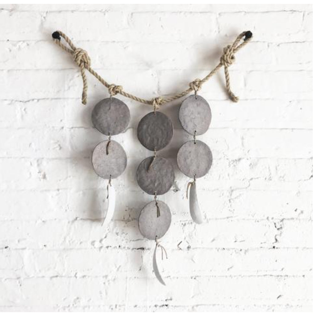 grey discs + featherbones wall hanging