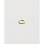 tiny pavé huggie in yellow gold