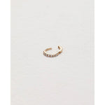 tiny pavé huggie in yellow gold